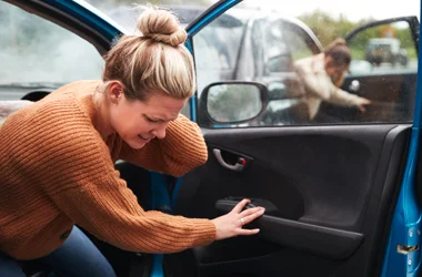 Person experiencing discomfort associated with an auto injury.