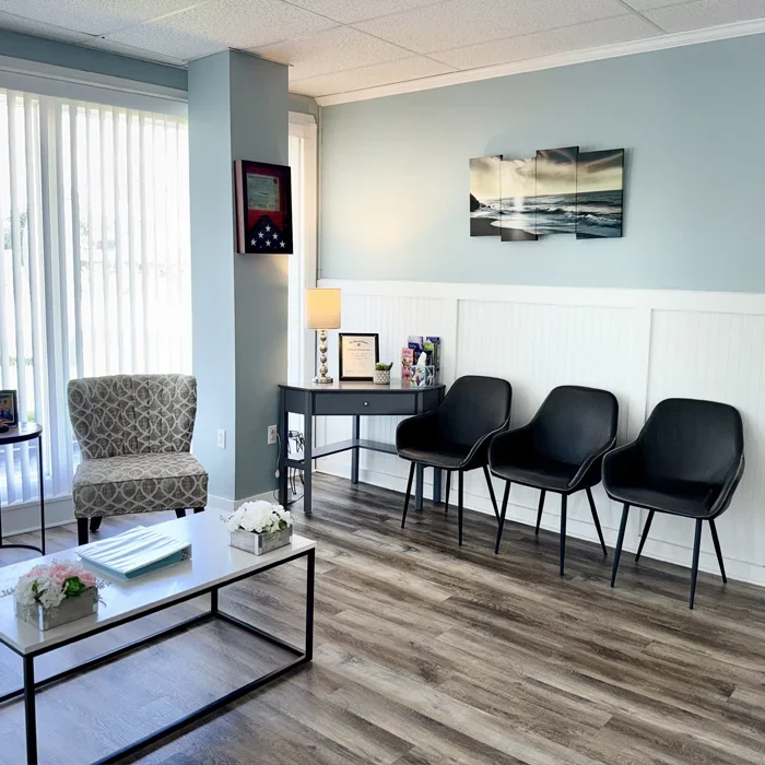 Cherry Point Chiropractic waiting room with several guest chairs and a coffee table.
